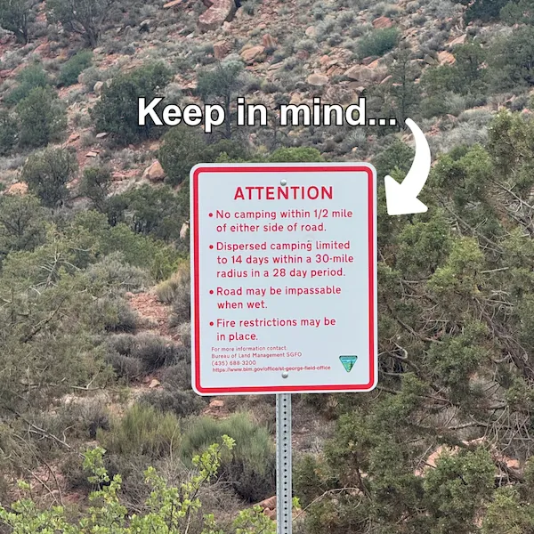 An image of a Bureau of Land Management sign outlining travel guidelines, including no camping within 1/2 mile of the road, limits on dispersed camping, warnings for impassable roads when wet, and potential fire restrictions. 