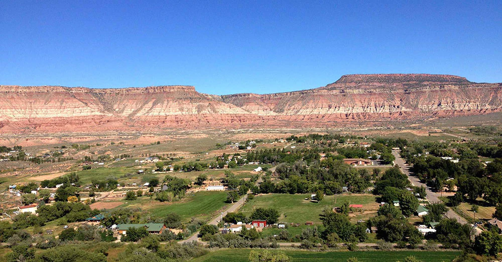 Virgin, Utah view from up high including surrounding red cliffs 