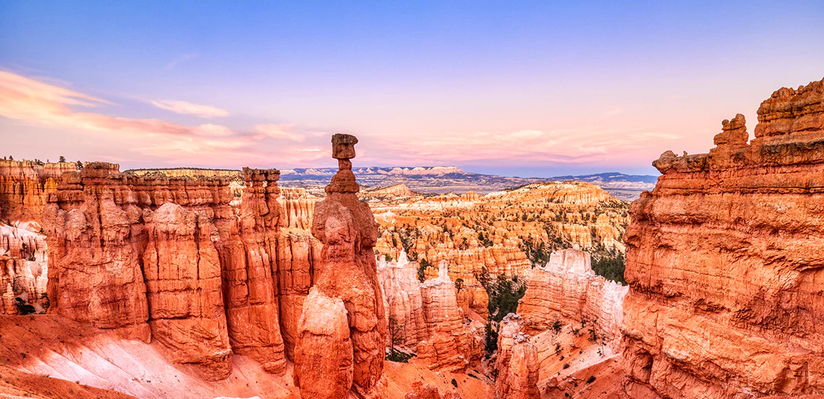 Red rock hoodoos and canyon formations in a desert landscape
